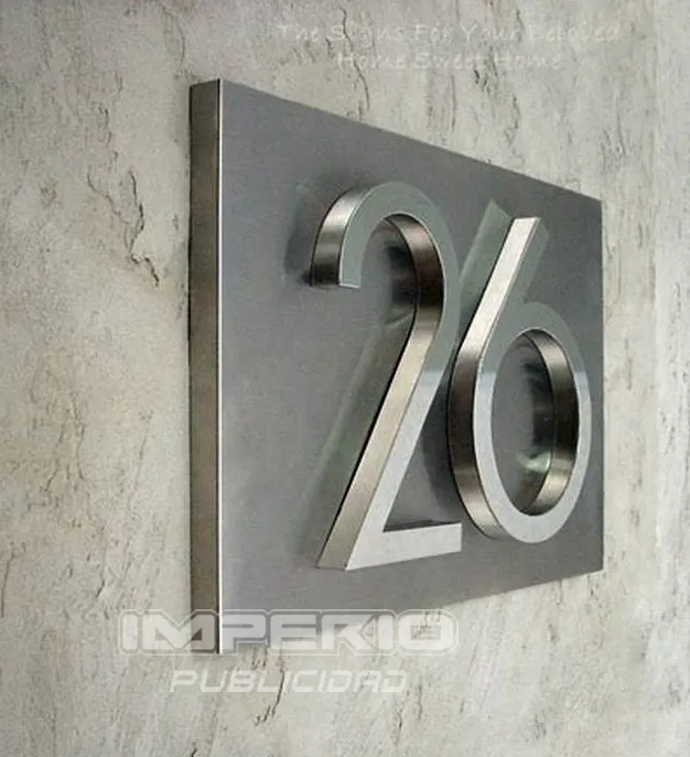 numeros-3d-acero-inoxidable-para-fachadas-cdmx Números 3D de acero inoxidable montados sobre placa metálica para fachadas modernas en CDMX
