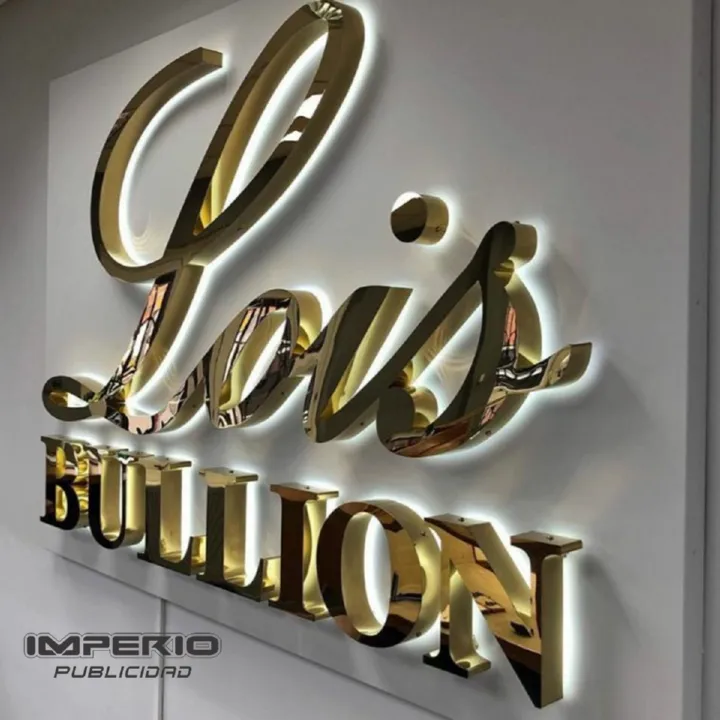 Letras 3D doradas retroiluminadas con iluminación halo LED para negocio.
